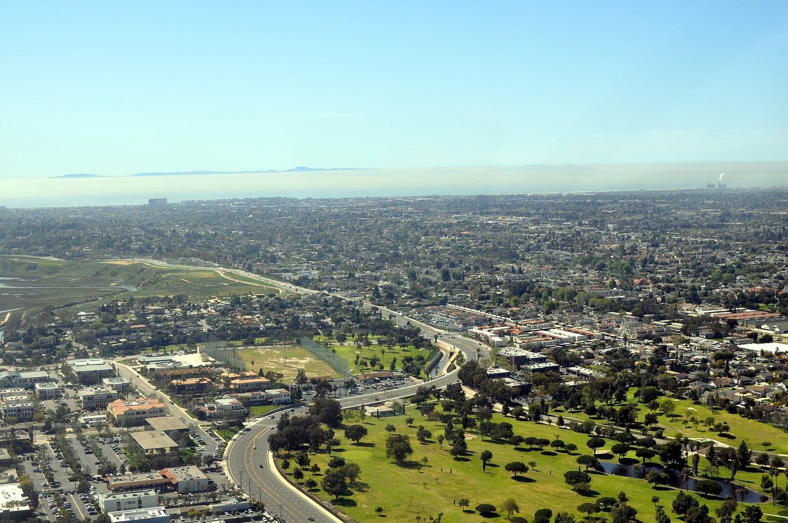 Aerial view over South Costa Mesa neighborhoods toward the coast